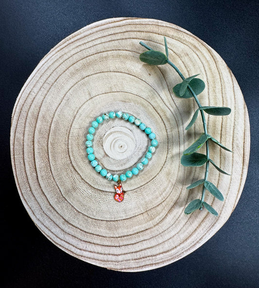 Bracelet de pierres semi-précieuses de Turquoise avec breloque de renard roux Boutique Poilue & Co.